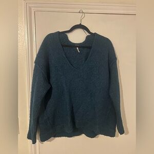 Basic free people wool sweater. Size medium. Color is a dark teal.